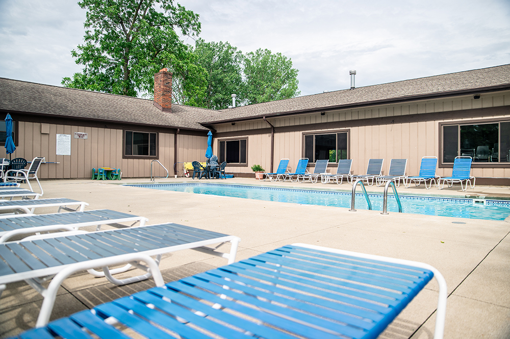 pool view with chairs